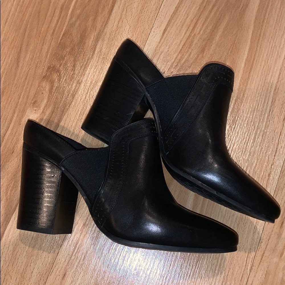 Black leather mules with laser cut trim